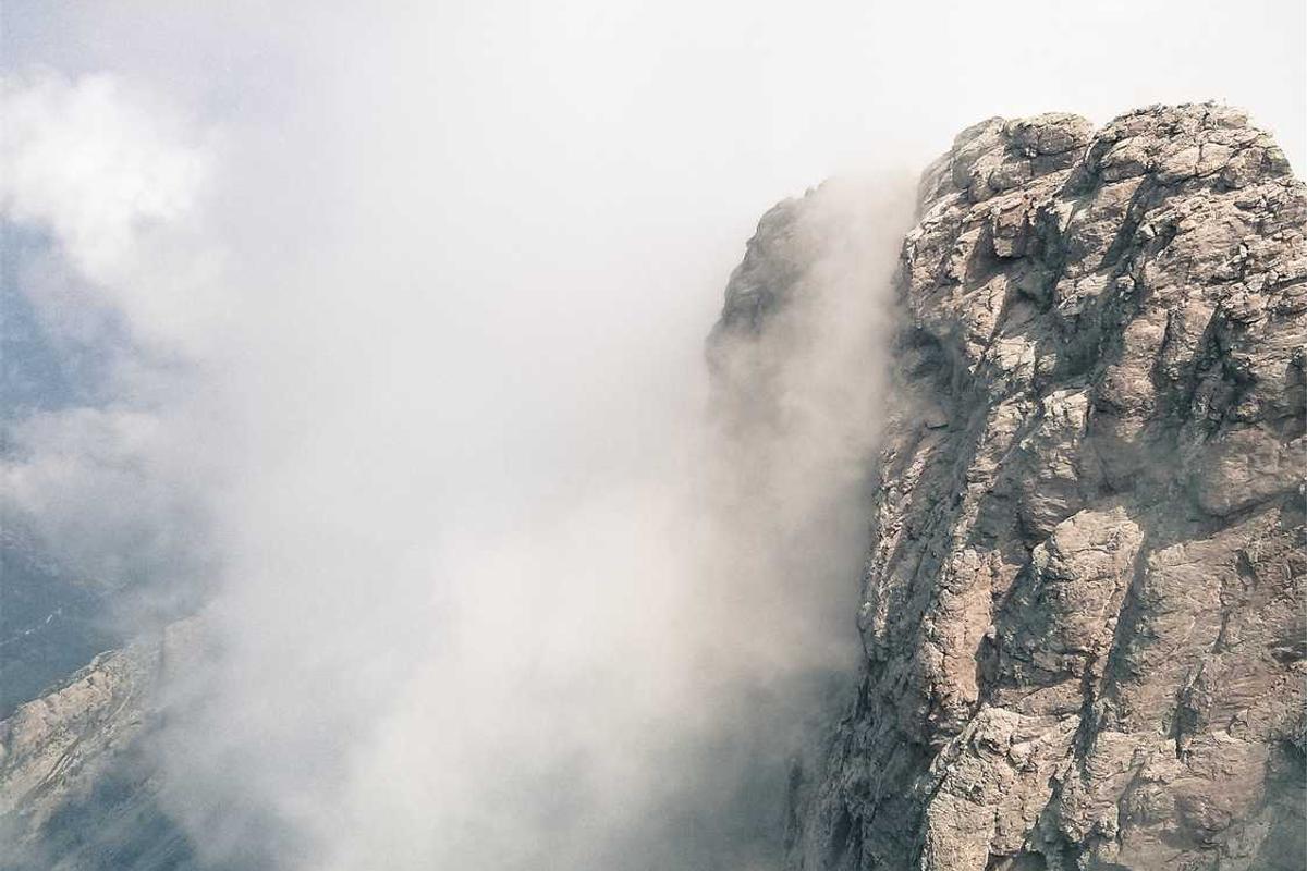 Person using a foldable clothes rack in a North Bangalore home